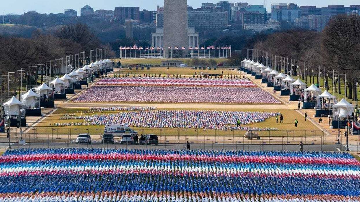 Flags are placed on the National Mall, looking towards the Washington Monument, and the Lincoln Memorial, ahead of the inauguration of President-elect Joe Biden and Vice President-elect Kamala Harris, Monday, Jan. 18, 2021, in Washington.