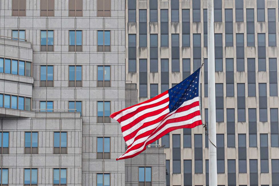 Flags are seen at half-staff in Lower Manhattan