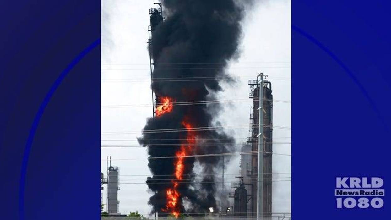 Flames and smoke rise after a fire started at an Exxon Mobil facility, Wednesday, July 31, 2019, in Baytown, Texas.