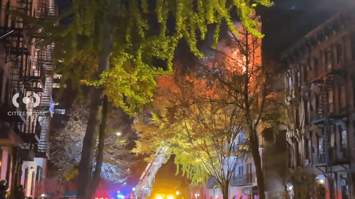 Flames and smoke were seen shooting out of 526 East 82nd St. on Monday night