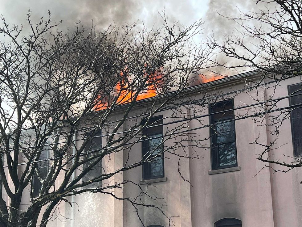 Flames coming from a 4-alarm fire at an East Williamsburg church on the afternoon of Easter Sunday.