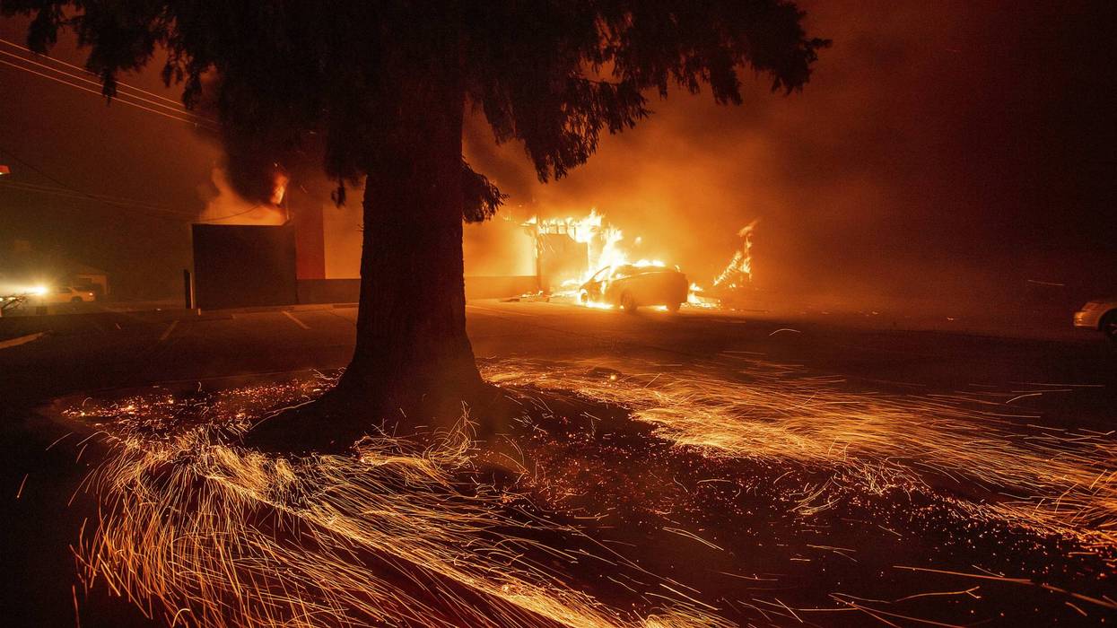 Flames consume a Kentucky Fried Chicken as the Camp Fire tears through Paradise, Calif., on Thursday, Nov. 8, 2018