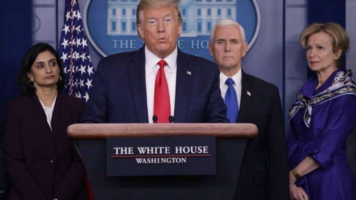 Flanked by members of the Coronavirus Task Force, U.S. President Donald Trump speaks during a news briefing on the latest development of the coronavirus outbreak.
