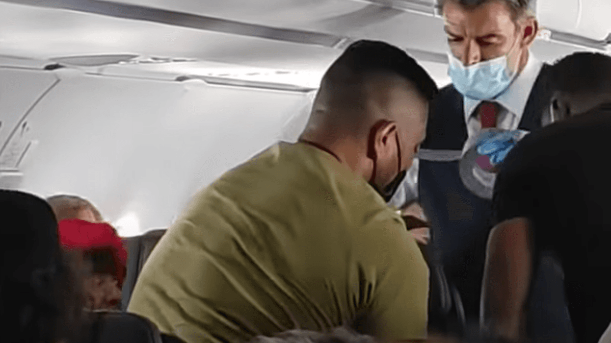 Flight attendant duct taping kid