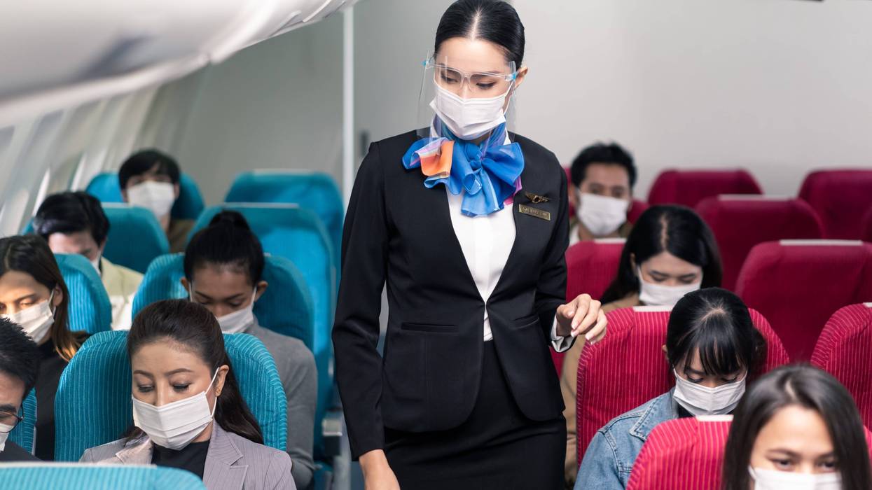 flight attendant in aisle