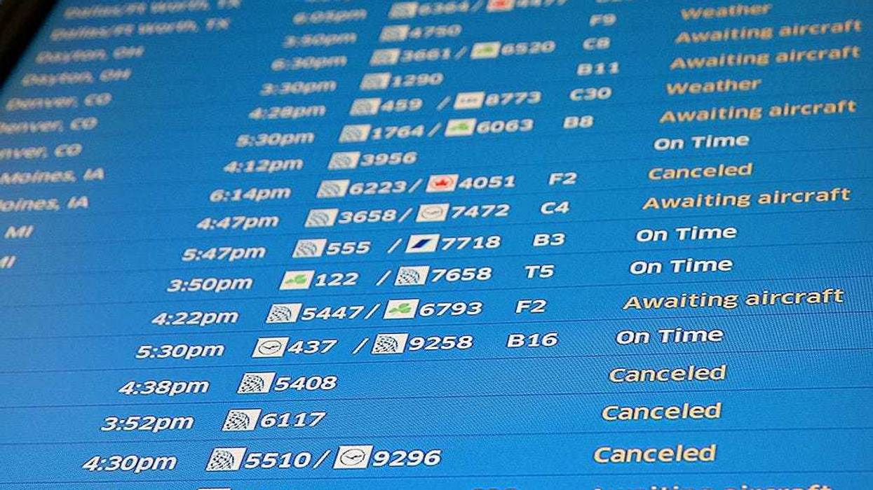 flight board with cancellations and delays