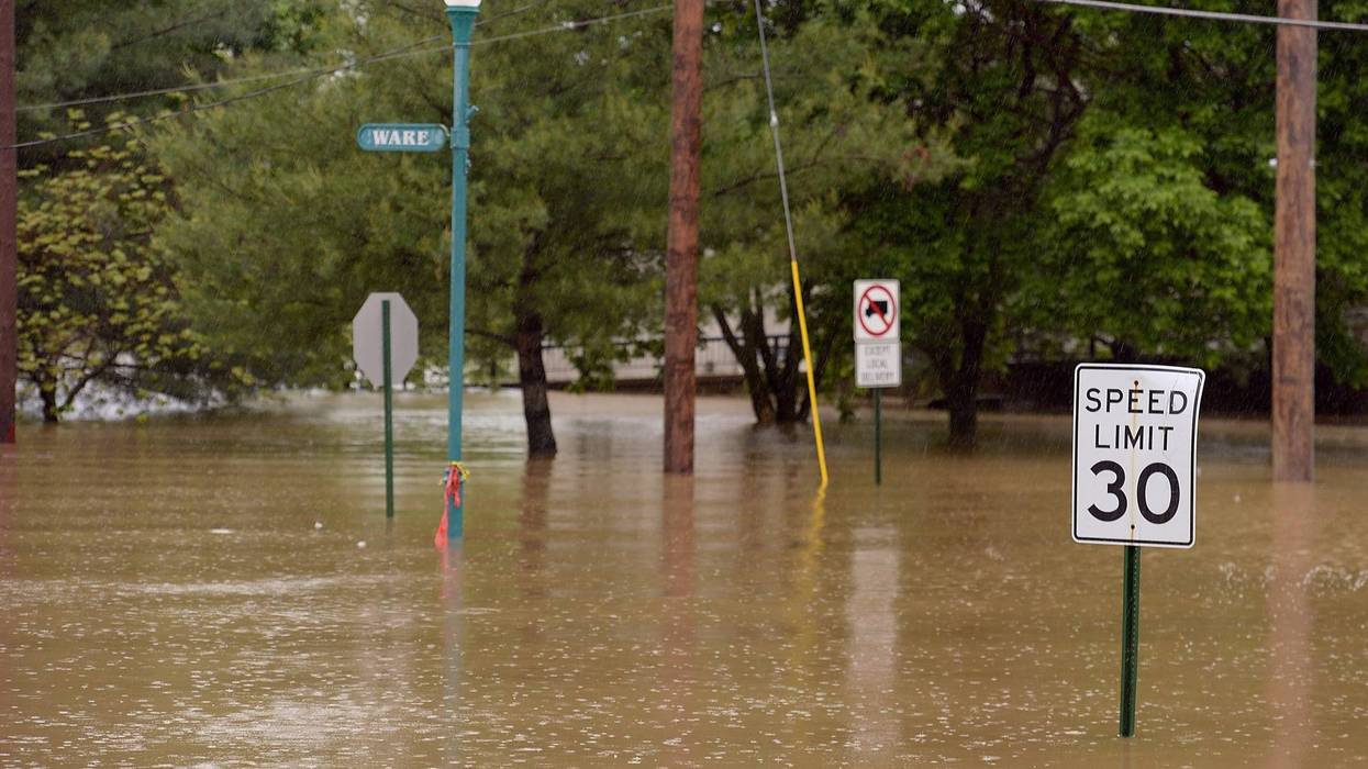 flooded street and 30 mph street sign