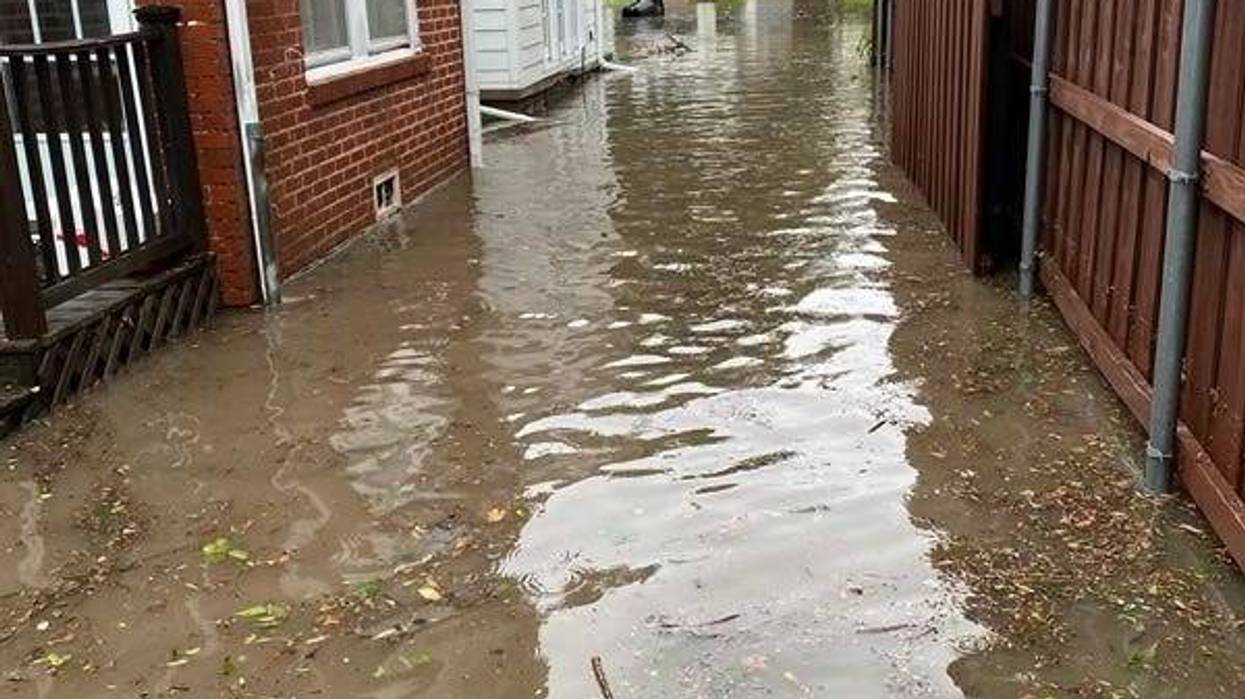 flooding between homes in Dallas County