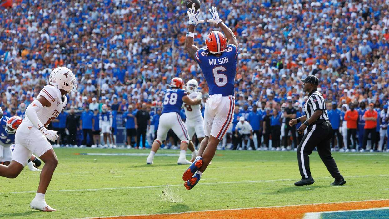 Florida Gators wide receiver Dallas Wilson (6) makes a catch for a touchdown against the Texas Longhorns during the first half at Ben Hill Griffin Stadium.