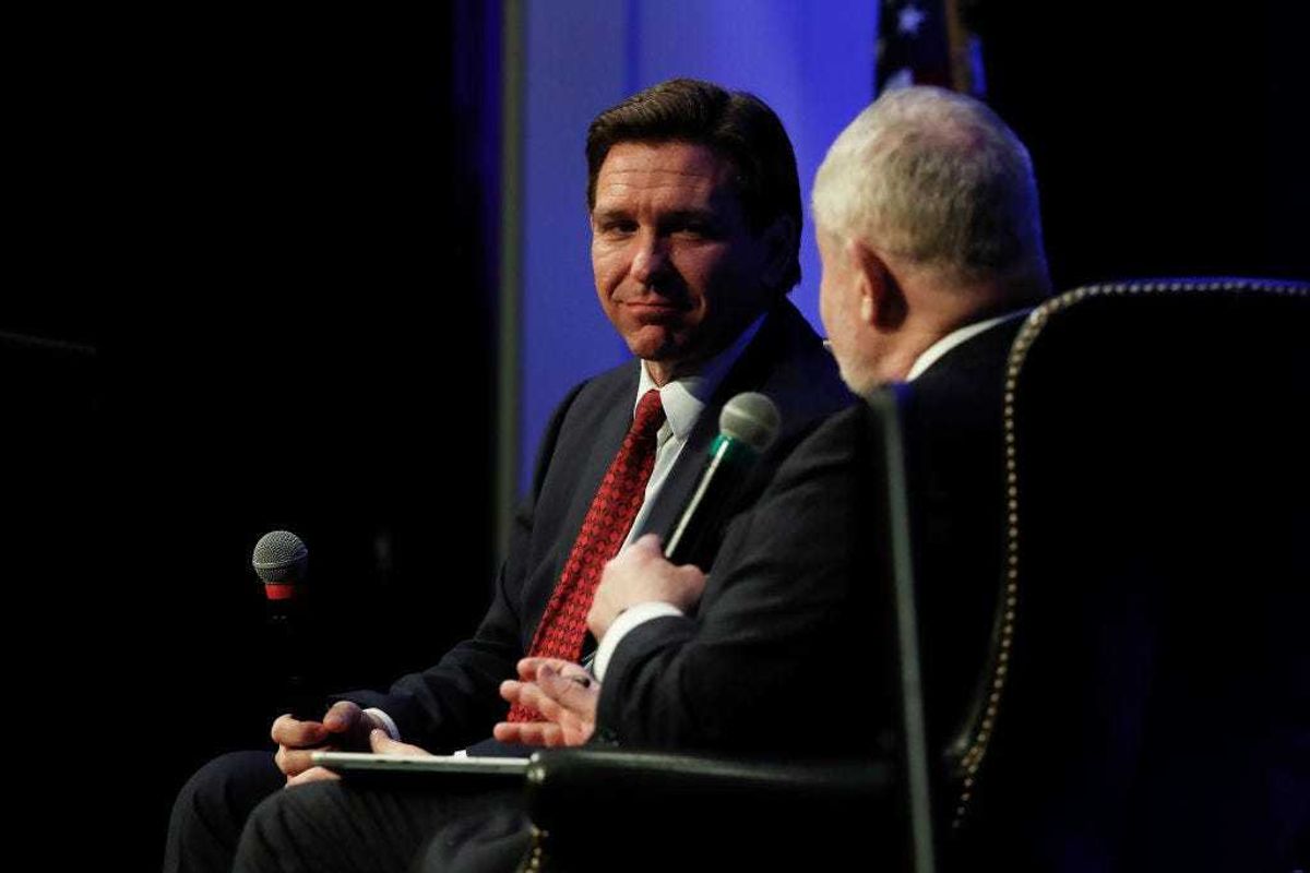 Florida Gov. Ron DeSantis (R-FL) listens to a question from Hillsdale College President Dr. Larry Arnn at Hillsdale College on April 6, 2023 in Hillsdale, Michigan.
