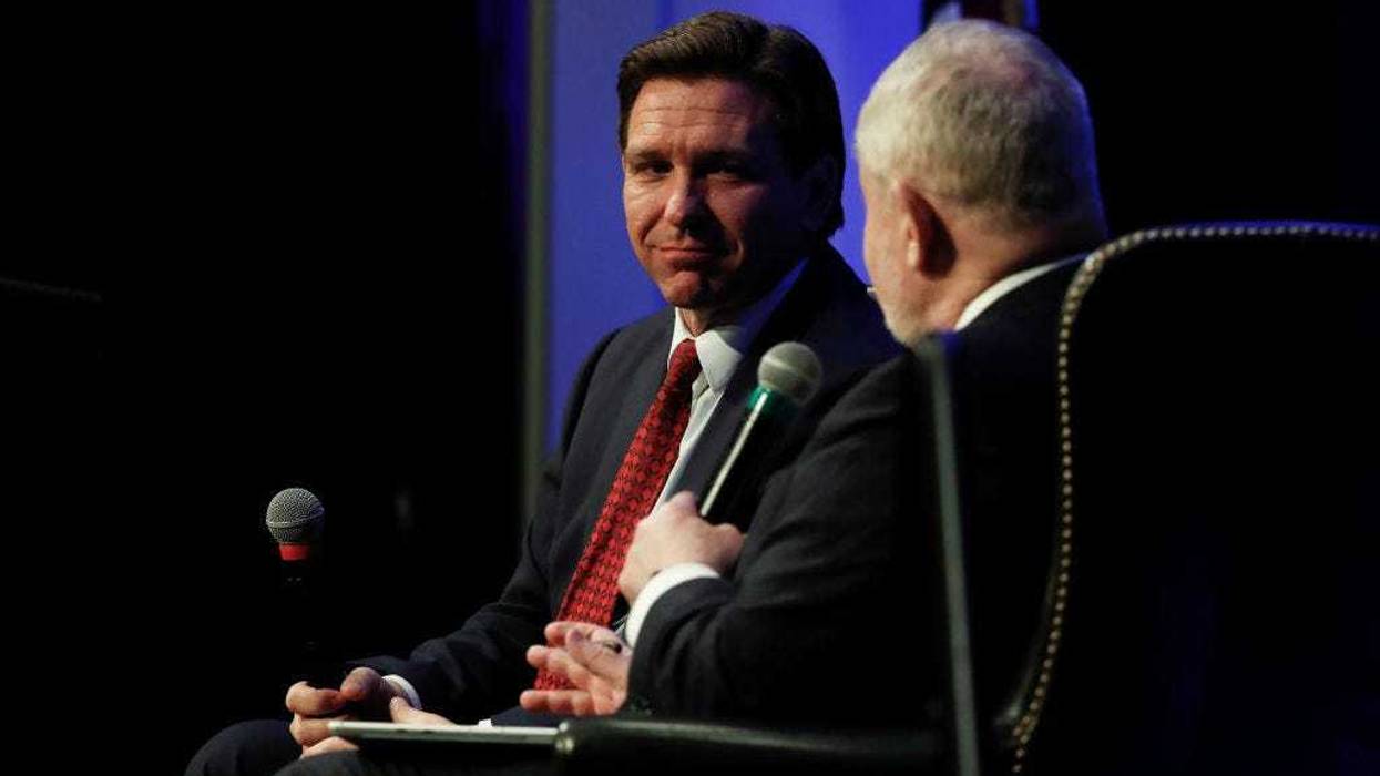 Florida Gov. Ron DeSantis (R-FL) listens to a question from Hillsdale College President Dr. Larry Arnn at Hillsdale College on April 6, 2023 in Hillsdale, Michigan.