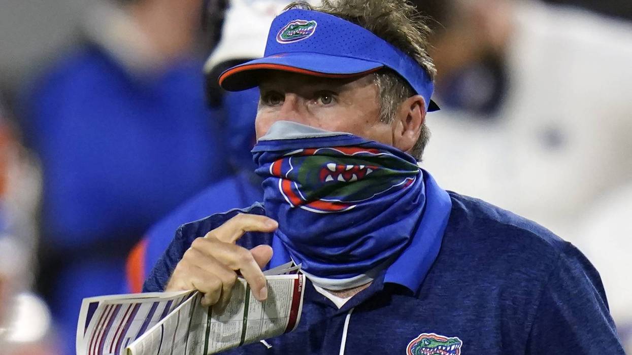 Florida head coach Dan Mullen, right, pauses during a timeout against Georgia during the second half of an NCAA college football game, Saturday, Nov. 7, 2020, in Jacksonville, Fla.