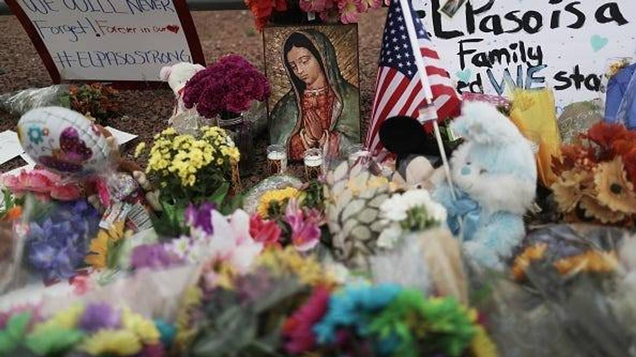 Flowers and mementos are seen at a makeshift memorial outside Walmart, near the scene of a mass shooting which left at least 20 people dead, on August 4, 2019 in El Paso, Texas. A 21-year-old male suspect was taken into custody in the city which sits alon