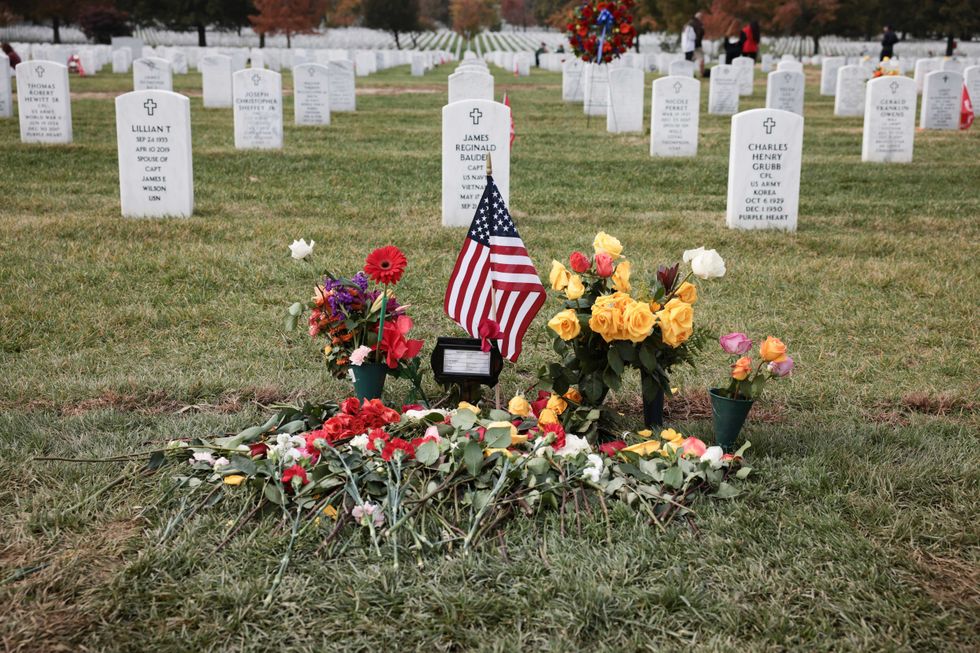 Flowers are placed at the burial site of former Secretary of State Colin Powell in Arlington National Cemetery on Veterans Day, November 11, 2021 in Arlington, Virginia.