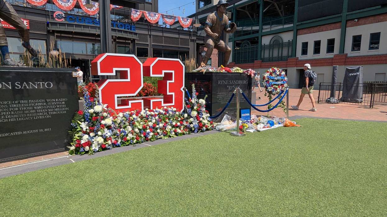 Flowers around Ryne Sandberg statue outside Wrigley Field