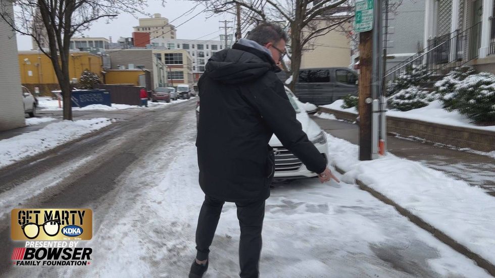 Flowing water is freezing on Carron Street and causing an icy mess for residents and businesses.
