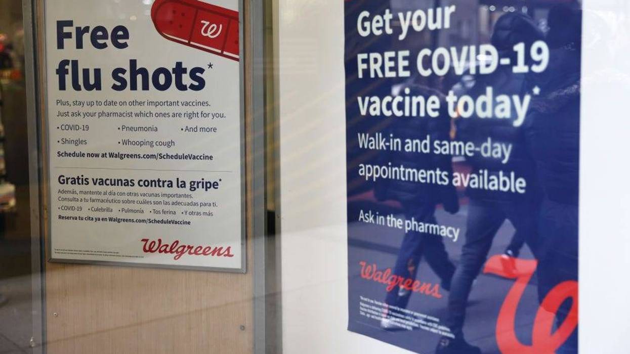 Flu and coronavirus (COVID-19) vaccine signage is seen at a Duane Reade by on Broadway on January 05, 2023 in New York City.
