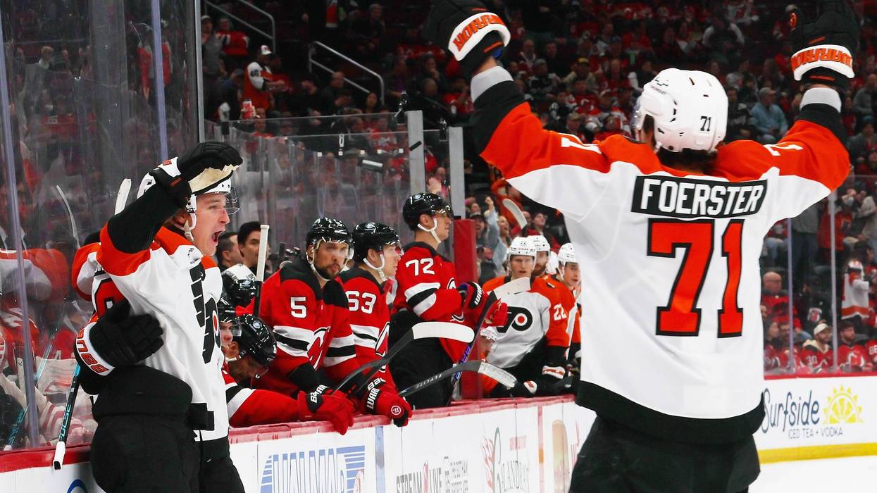 Flyers center Trevor Zegras celebrates his goal against the New Jersey Devils at 1:56 of the first period with right winger Tyson Foerster at Prudential Center on Tuesday, April 7 in Newark, New Jersey.
