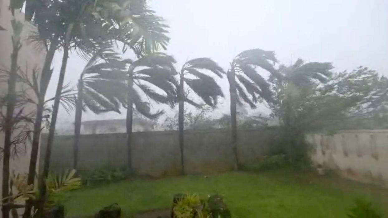 Flying tree limbs, collapsed buildings as major typhoon in Pacific bears down on remote US islands