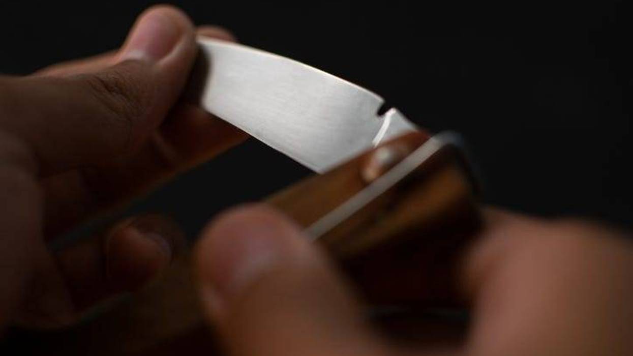 folding knife held in hands