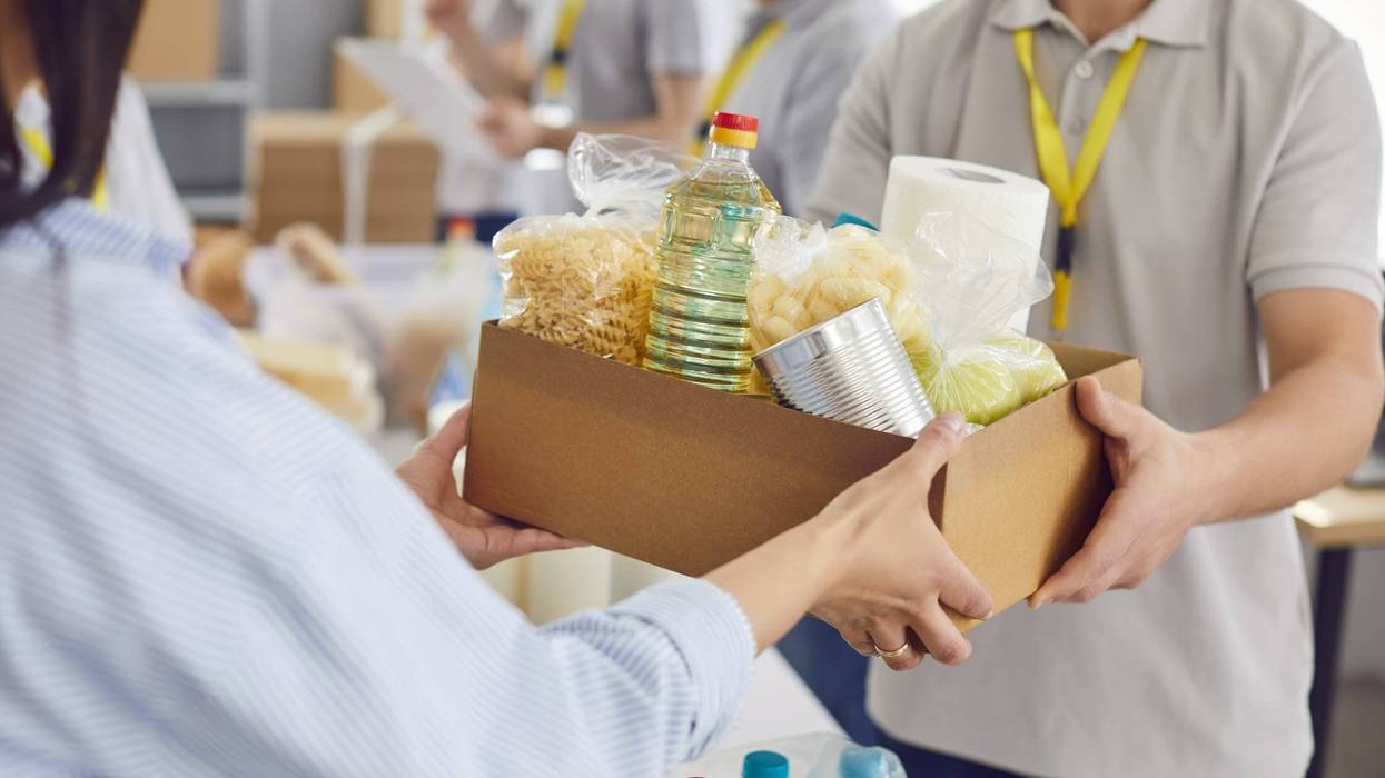 Food box giving to help, caring volunteer group working in charitable food foundation, make donation