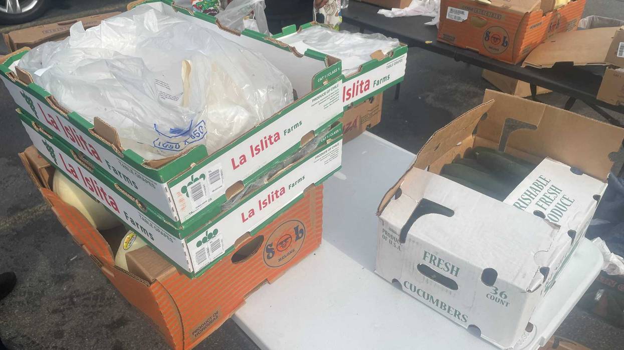 Food is being distributed to nearby residents who are now in a food desert with the temporary closure of Tops following the shooting on Jefferson Avenue Saturday.