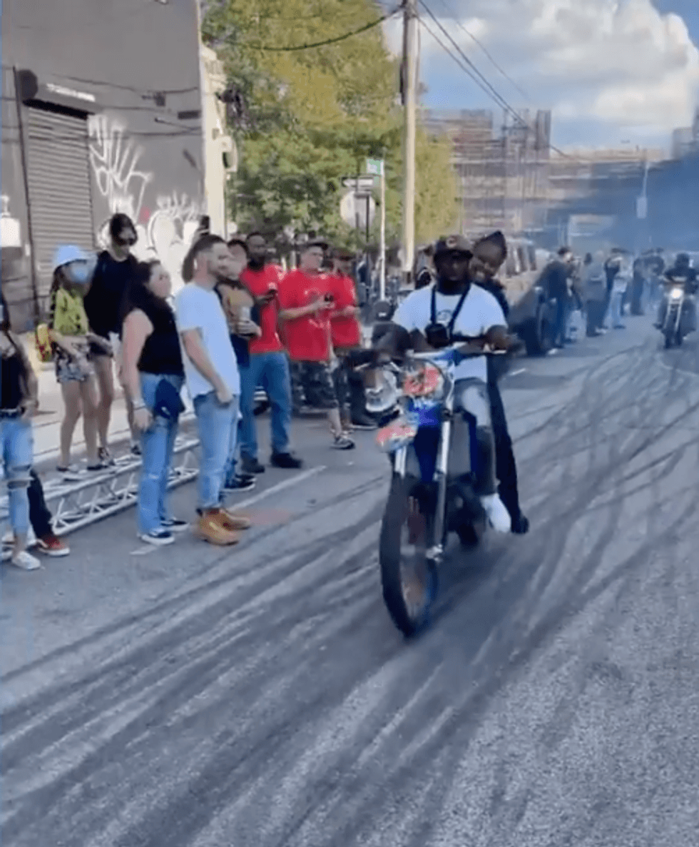 Footage of NYPD Officer Scott on the back of a dirtbike in Brooklyn.