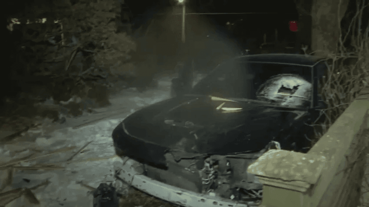 Footage of the car coming to a rest in the front yard of a house on Pelham Road in West Mount Airy early Sunday morning.