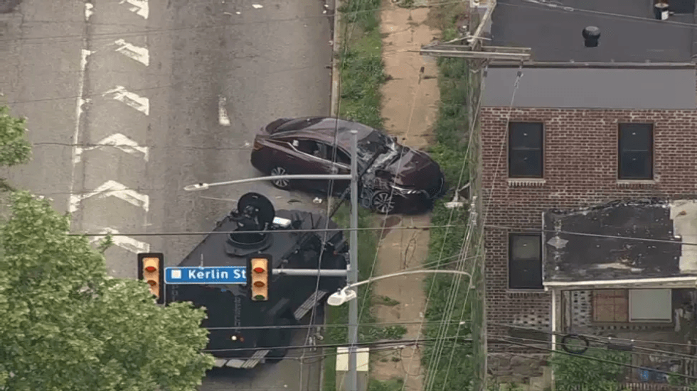 For a third time, the suspect attempted to evade police by driving away in this maroon sedan, but officers from several law enforcement agencies stopped with her with gunfire.