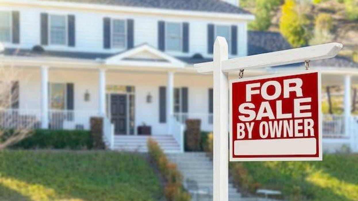 "For Sale" sign outside of home