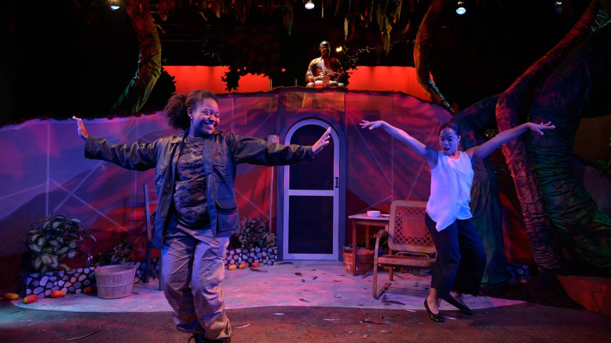 Foreground: Cianna Castro (Camilla Marie) and Taysha Marie Canales (Maria Soledad), background: Anssumane Silla (Percussion).