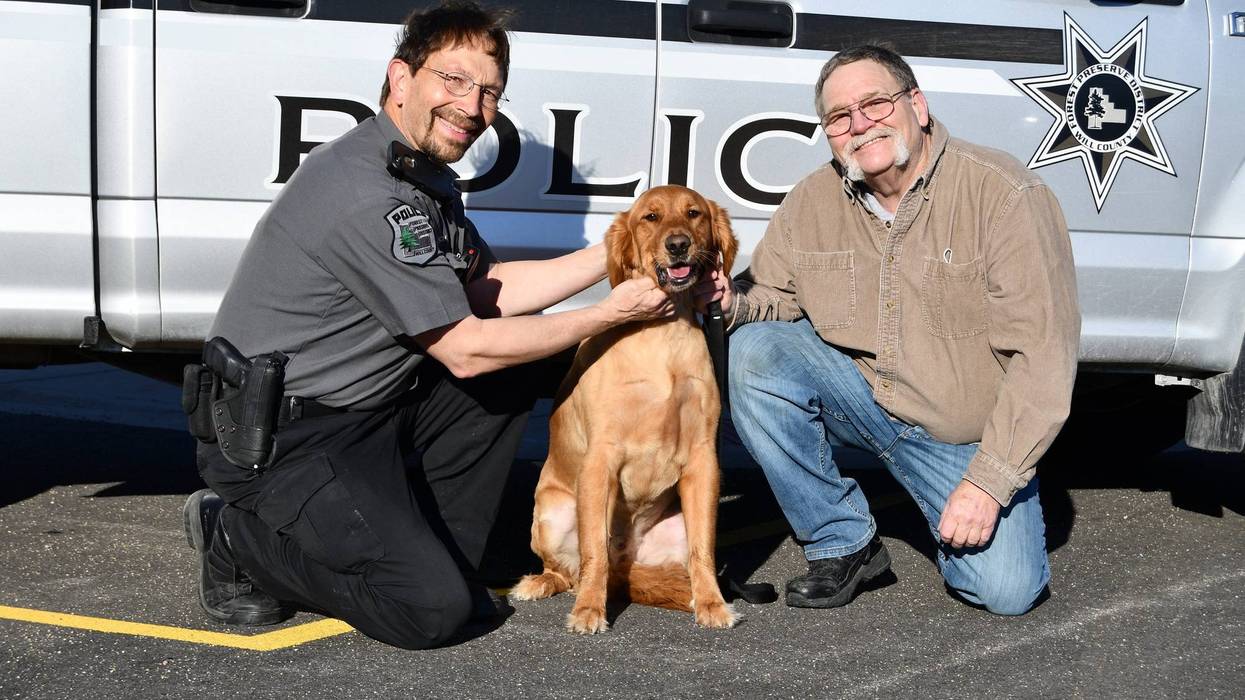 Forest Preserve District of Will County Police Officer Dan Rankovich and Frankfort resident Kim Jones pose with Jones’ dog Rocco, who ran out onto the ice at Monee Reservoir on March 5 and was rescued from the frigid water by Monee firefighters with assistance from Rankovich.