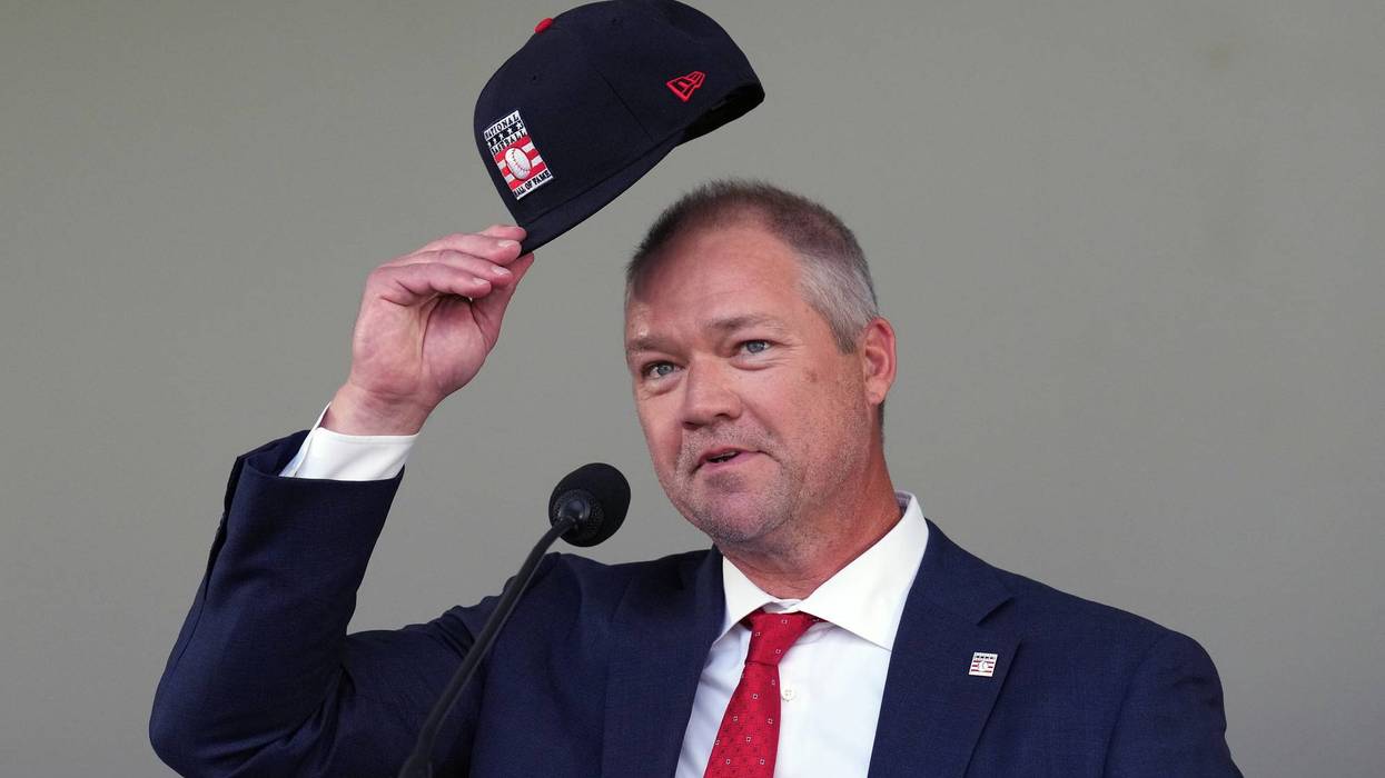 Former Cardinals third baseman Scott Rolen tips his cap to his parents after giving his Baseball Hall of Fame induction speech
