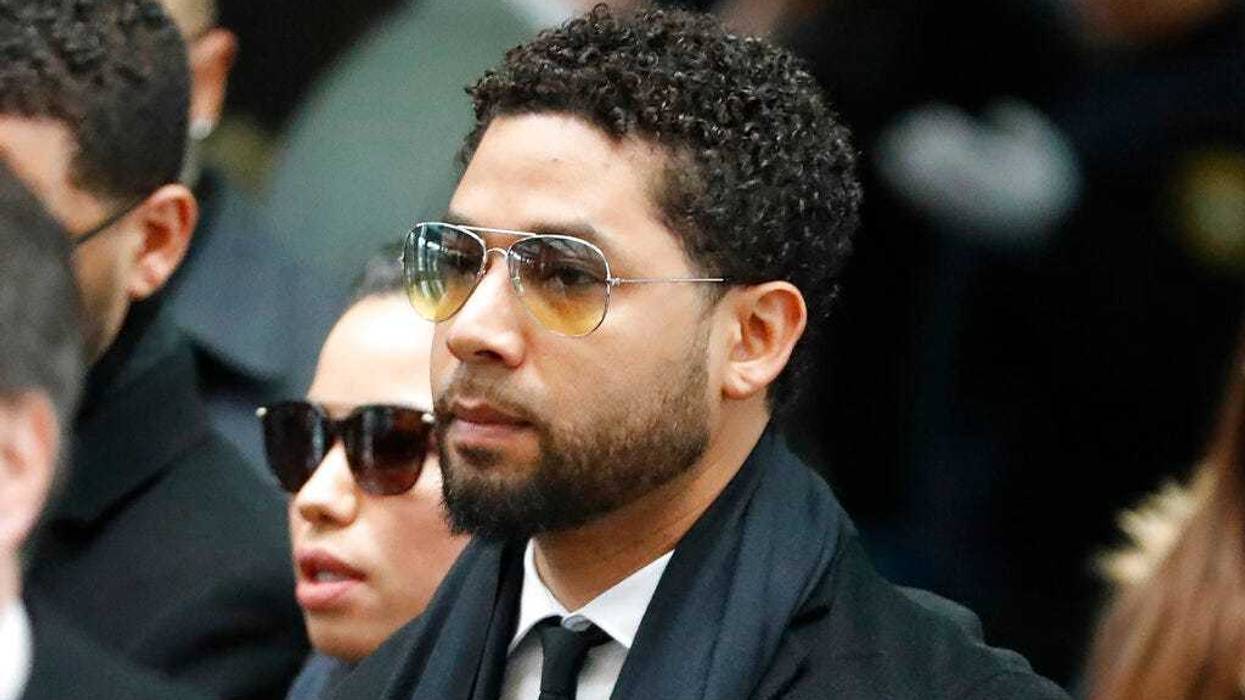 Former "Empire" actor Jussie Smollett, center, arrives for an initial court appearance Monday, Feb. 24, 2020, at the Leighton Criminal Courthouse in Chicago