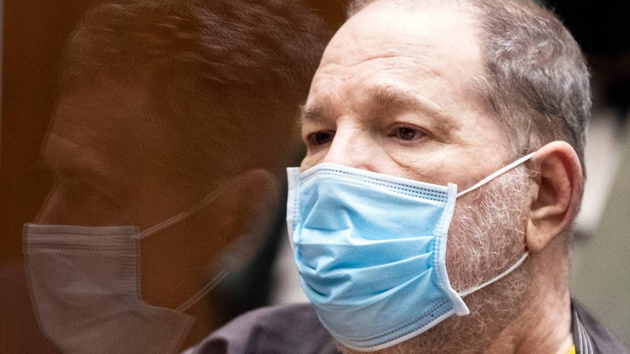 Former film producer Harvey Weinstein (R) listens in court as his attorney Mark Werksman is reflected in the glass in front of him during a pre-trial hearing for Weinstein, who was extradited from New York to Los Angeles to face sex-related charges at Clara Shortridge Foltz Criminal Justice Center on July 29, 2021 in Los Angeles, California.