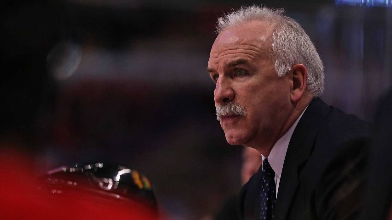 Former Head Coach Joel Quenneville of the Chicago Blackhawks gives instructions to his team against the Colorado Avalanche at the United Center on Dec. 27, 2013, in Chicago.