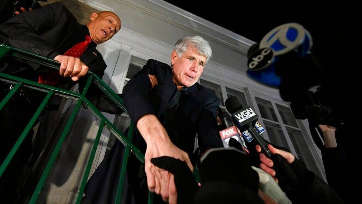 Former Illinois Gov. Rod Blagojevich shakes hands with a supporter as he arrives home in Chicago on Wednesday, Feb. 19, 2020, after his release from Colorado prison late Tuesday.