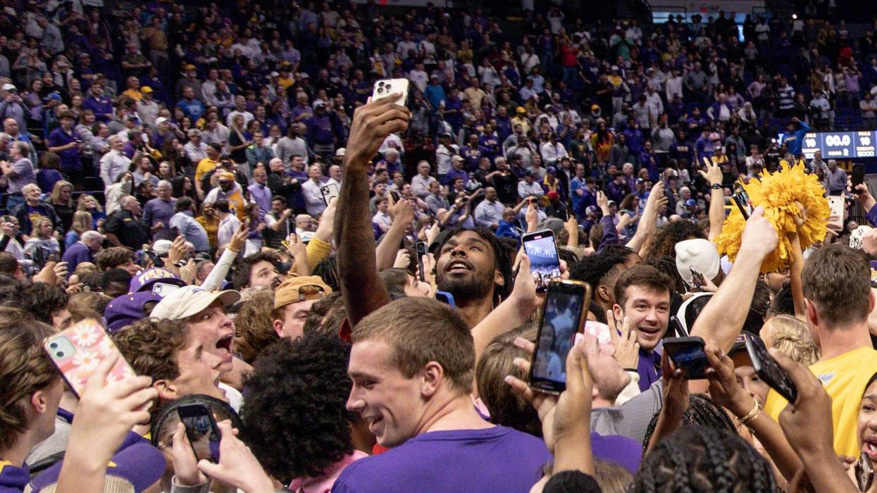 Former LSU Tigers and current Houston Rocket forward Tari Eason middle of screen takes a selfie as LSU Tigers defeat the Kentucky Wildcats