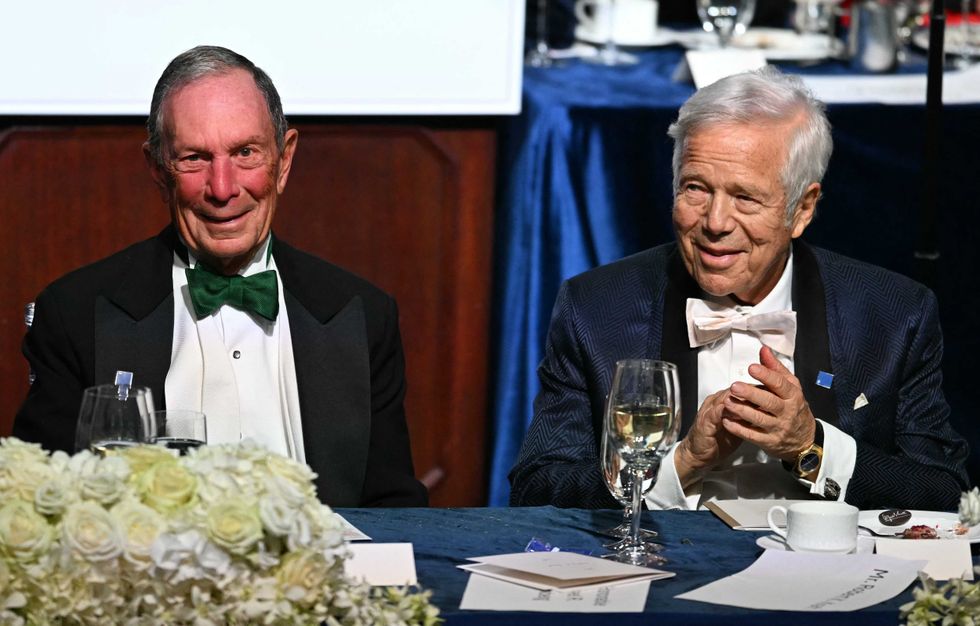 Former Mayor Michael Bloomberg (L) and CEO of the New England Patriots Robert Kraft (R) attend the 79th Annual Alfred E. Smith Memorial Foundation Dinner with former US President and Republican presidential candidate Donald Trump at the Hilton Midtown in New York, October 17, 2024