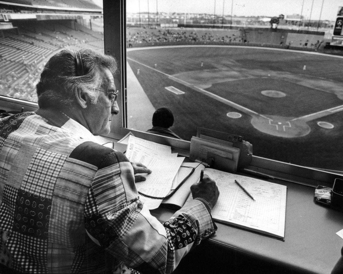 Former Milwaukee Braves catcher and current Brewers announcer Bob Uecker shown at work in the Milwaukee County Stadium broadcast booth.