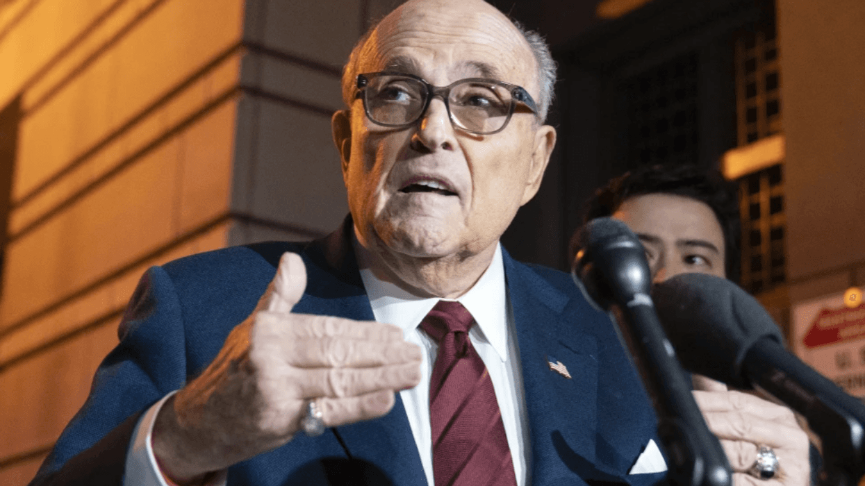 Former New York City Mayor Rudy Giuliani talks to reporters as he leaves a federal courthouse in Washington on Dec. 11, 2023. A judge threw out his bankruptcy case on Friday, July 12, 2024.