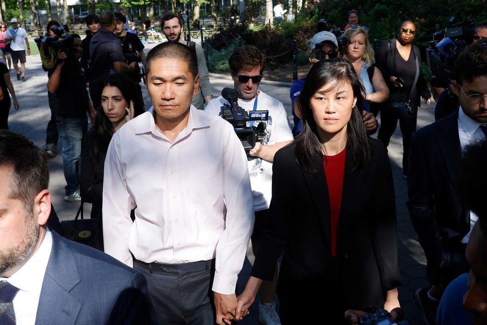 Former New York Governor Kathy Hochul aide Linda Sun, right, and her husband, Christopher Hu leave Brooklyn Federal Court after their arraignment, Tuesday, Sept. 3, 2024, in New York. Sun is charged with being an aide to the Chinese government