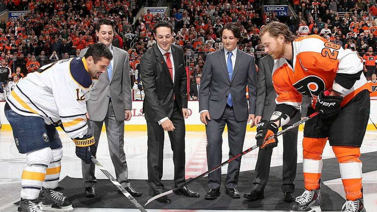 Former Philadelphia Flyer Danny Briere along with his sons Caelan Briere,Carson Briere and Cameron Briere drop the puck in a ceremony with Buffalo Sabres captain Brian Gionta #12 and Flyers captain Claude Giroux #28 before the game on October 27, 2015 at the Wells Fargo Center in Philadelphia, Pennsylvania. (Photo by Elsa/Getty Images)