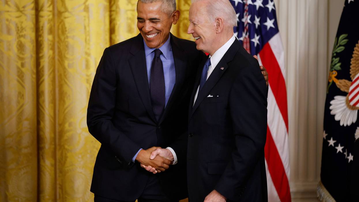 Former President Barack Obama (L) and U.S. President Joe Biden shake hands during an event to mark the 2010 passage of the Affordable Care Act in the East Room of the White House on April 05, 2022 in Washington, D.C.