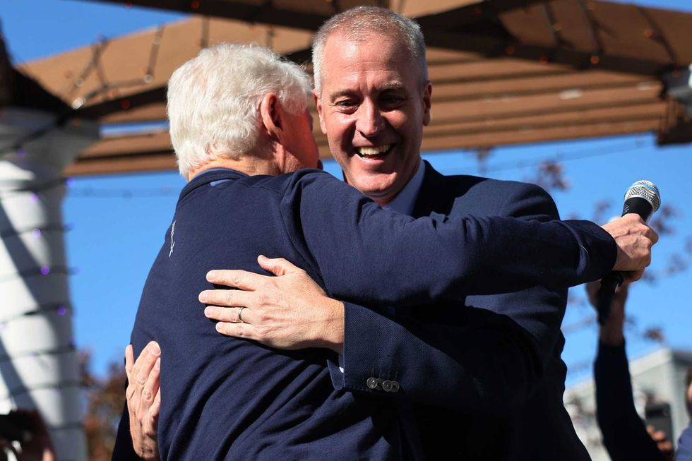 Former President Bill Clinton and Rep. Sean Patrick Maloney (D-NY) embrace during a rally at Nyack Veteran
