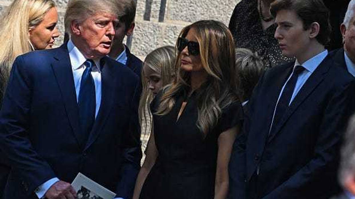 Former President Donald J. Trump, Melania Trump and Barron Trump exit the funeral of Ivana Trump at St. Vincent Ferrer Roman Catholic Church July 20, 2022 in New York City.
