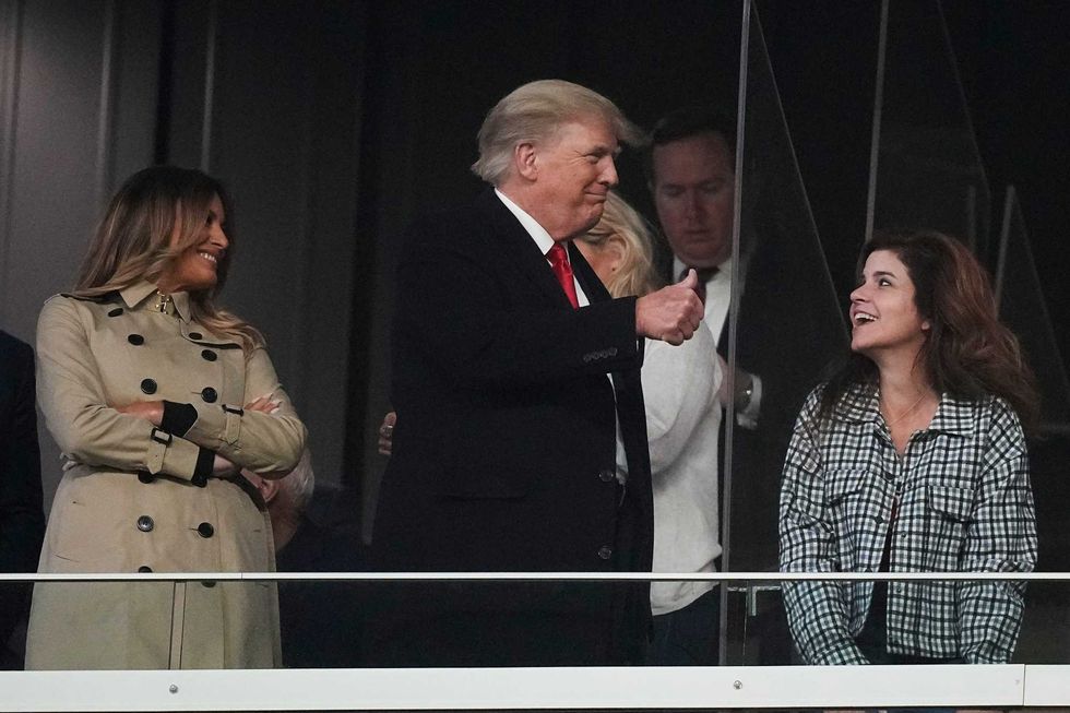 Former President Donald Trump and his wife Melania arrive for Game 4 of baseball