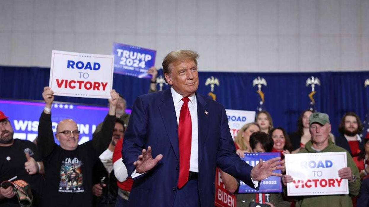 Former President Donald Trump arrives for a rally on April 02, 2024 in Green Bay, Wisconsin. At the rally, Trump spoke next to an empty lectern on the stage and challenged President Joe Biden to debate him. The Wisconsin primary is being held today.