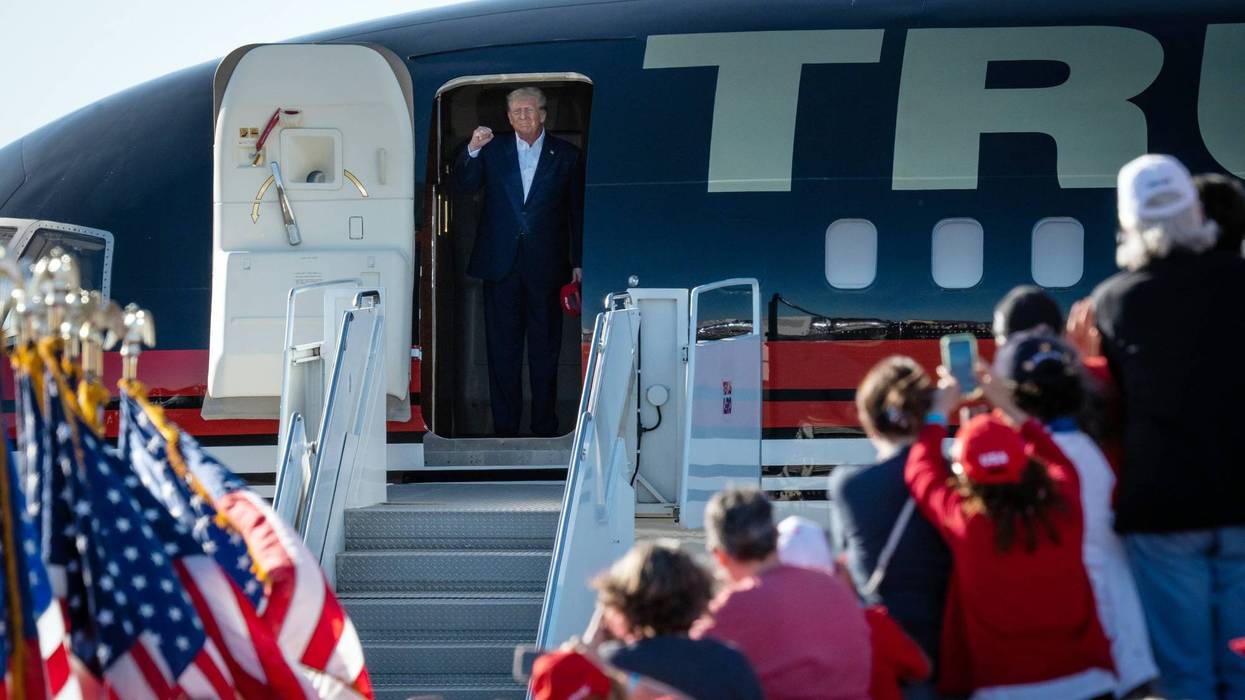 Former President Donald Trump gets off his plane after landing at the Waco Regional Airport for his Make America Great Again Rally in Waco, Texas, March 25, 2023.
