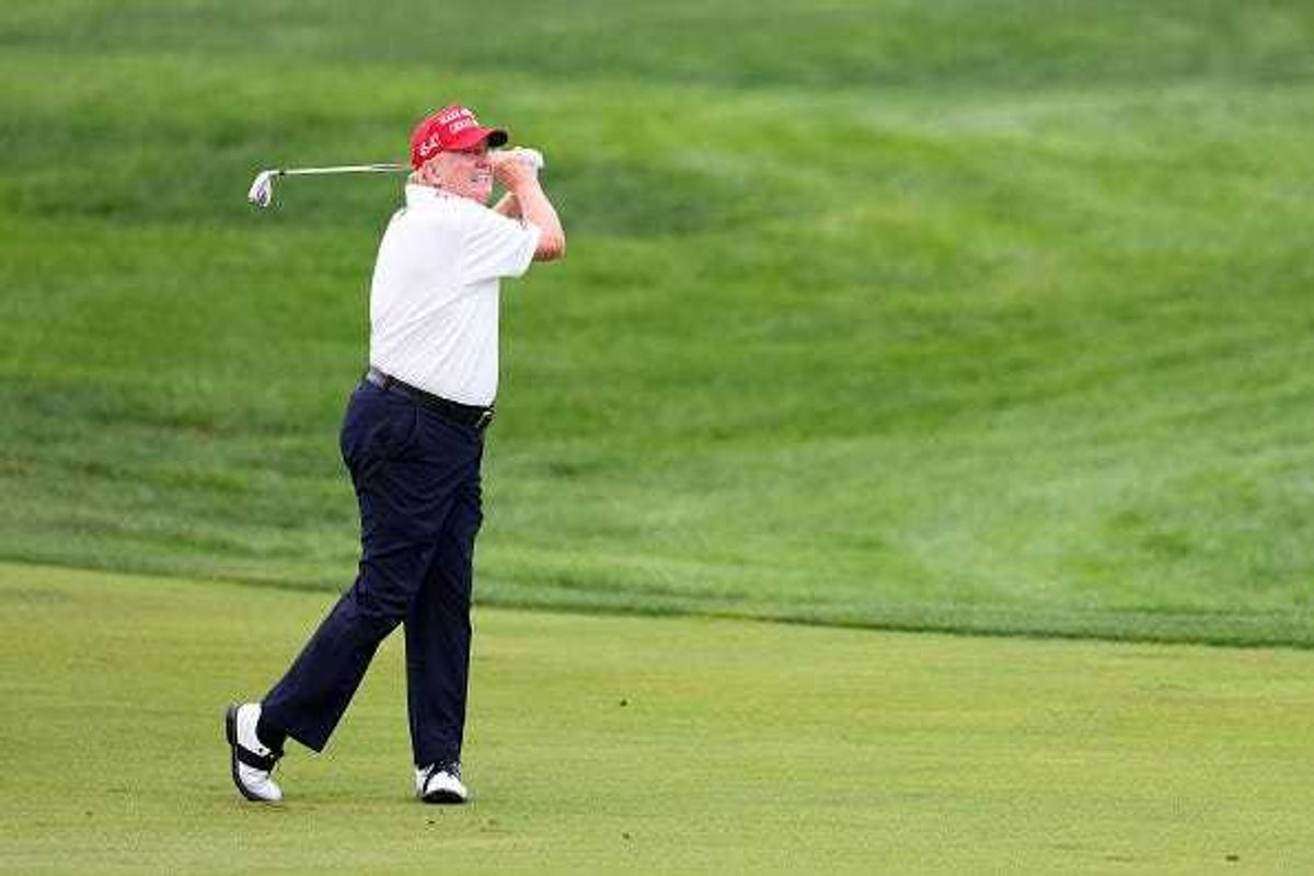 Former President Donald Trump hits his shot from the first fairway during the pro-am prior to the LIV Golf Invitational - Bedminster at Trump National Golf Club on August 10, 2023 in Bedminster, New Jersey.